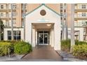 Inviting building entrance featuring clean architecture, well-maintained landscaping, and prominent address signage at 2320 Terra Ceia Bay Blvd # 206, Palmetto, FL 34221