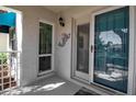 Close-up of the front door with decorative mermaid and window at 318 108Th St W # 318, Bradenton, FL 34209