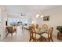 Inviting living room with tile floors, modern furniture, and sliding glass doors with a waterfront view at 4310 Falmouth Dr # 304, Longboat Key, FL 34228