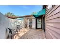 Charming brick patio with seating, sliding glass doors, and convenient access to the home's entrance at 4423 Park Lake N Ter, Bradenton, FL 34209