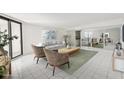 Bright living room with modern decor and glass sliding door to a balcony, staged for appeal at 4822 Ocean Blvd # 11E, Sarasota, FL 34242