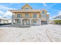 Exterior of new construction home with large windows and open porch at 525 68Th St St, Holmes Beach, FL 34217