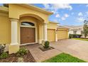 Elegant front entrance with double doors and decorative pillars at 5342 98Th E Ave, Parrish, FL 34219