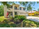 Well-maintained home with lush landscaping and a spacious driveway at 6156 41St E St, Bradenton, FL 34203