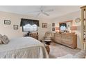 Cozy bedroom with neutral decor, ample natural light, and a comfortable workspace at 7223 Wood Creek Dr # 22, Sarasota, FL 34231