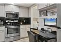 Well-equipped kitchen with stainless steel appliances and a convenient breakfast nook at 7223 Wood Creek Dr # 22, Sarasota, FL 34231