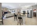 Stylish kitchen with white cabinets, stainless steel appliances, and a functional breakfast bar at 7604 49Th E Ave, Bradenton, FL 34203