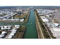 Community aerial view shows waterfront access, baseball field, and proximity to highways and commercial zones at 789 N Green Cir, Venice, FL 34285
