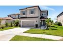 Charming two-story home features a spacious driveway and an attached two-car garage at 8262 Velda Trl, Sarasota, FL 34241