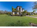 Attractive two-story home with a green lawn and a paver driveway at 10905 Copperlefe Dr, Bradenton, FL 34212
