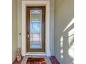 Inviting front door with a glass panel, decorative wreath, and a 'Happy' welcome mat at 2322 5Th E St, Palmetto, FL 34221