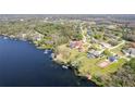 Beautiful waterfront homes with private docks and boat lifts offer direct access to the water at 282 Rue Des Lacs, Tarpon Springs, FL 34688