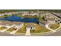 Beautiful aerial view of the home nestled within a serene lakeside community at 3677 Turning Tides Ter, Bradenton, FL 34208