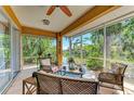 Comfortable screened-in patio with scenic water views, perfect for outdoor relaxation at 417 Tortuga Dr, Nokomis, FL 34275