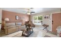 Comfortable living room with natural light, tile flooring, and contemporary furnishings at 5562 Hayden Blvd, Sarasota, FL 34232