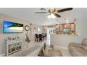 Bright living room featuring an open concept layout and a view into the dining area at 5562 Hayden Blvd, Sarasota, FL 34232