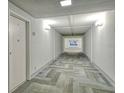 Clean, well-lit hallway with patterned carpeting and access to multiple units at 5855 Midnight Pass Rd # 303, Sarasota, FL 34242