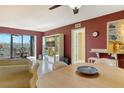Living room with a dining area and balcony with a scenic view at 5855 Midnight Pass Rd # 303, Sarasota, FL 34242