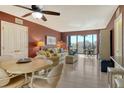Cozy living room with a dining area and balcony access at 5855 Midnight Pass Rd # 303, Sarasota, FL 34242