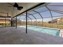 Scenic swimming pool featuring a screened enclosure with views of the outdoors at 7406 61St E St, Palmetto, FL 34221