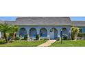 Charming single-story home with arched entryway, well-maintained landscaping, and inviting curb appeal at 3807 41St Street W Ct # 52, Bradenton, FL 34205
