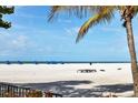 Beautiful beach view, with palm trees and plenty of sand at 1001 Benjamin Franklin Dr # 511, Sarasota, FL 34236