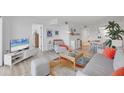 Bright living space, with white walls, flows into the dining area, creating an open and airy atmosphere at 1001 Benjamin Franklin Dr # 511, Sarasota, FL 34236