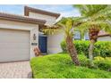 Charming single-story home featuring a private front entrance, attached garage, and well-manicured landscaping at 1290 Cielo Ct, North Venice, FL 34275