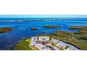 Beautiful aerial shot showcasing waterfront condos surrounded by lush mangroves at 1389 Perico Point Cir # 140, Bradenton, FL 34209