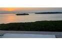 Tranquil sunset view overlooking the water and small islands at 1389 Perico Point Cir # 140, Bradenton, FL 34209