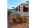 Charming mobile home with a cozy patio and well-maintained landscaping at 1674 University Pkwy # 389, Sarasota, FL 34243