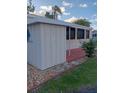 Exterior view of the property highlighting the outdoor space and surrounding landscape at 1674 University Pkwy # 389, Sarasota, FL 34243