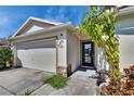 Close-up of the front door and garage showcasing the home's architectural details at 3514 14Th E Ct, Ellenton, FL 34222