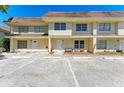 Charming townhome featuring a well-manicured lawn, outdoor seating, and ample parking space at 3717 Delta St # 95, Sarasota, FL 34232