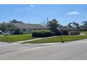 Well maintained home with lush landscaping, and a large green lawn at 3799 Countryside Rd, Sarasota, FL 34233
