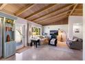 Cozy living room featuring a vaulted wood ceiling, comfortable seating, and large windows at 426 S Shore Dr, Sarasota, FL 34234