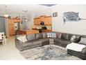 Open layout with gourmet kitchen, tile flooring, and comfortable seating area at 4506 62Nd E Ter, Bradenton, FL 34203