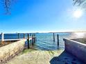 Private boat ramp offering direct access to the serene waterway with bright, clear skies at 4524 106Th W St, Bradenton, FL 34210