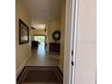 Inviting entryway featuring neutral tones and tile flooring, leading into the home at 5962 Roseto Pl, Sarasota, FL 34238