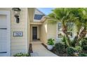 Inviting front entryway showcasing a well-lit porch and manicured landscaping at 7424 Ridgelake Cir, Bradenton, FL 34203