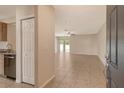 Spacious living room with tile flooring and a view of the backyard through sliding glass doors at 8996 Excelsior Loop, Venice, FL 34293