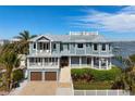 Stunning waterfront home with a rooftop deck and beautiful architecture offers amazing views and access to the water at 110 10Th S St, Bradenton Beach, FL 34217