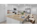 Modern kitchen with a large island, stainless steel appliances, and ample counter space at 14061 Heritage Landing Blvd # 412, Punta Gorda, FL 33955
