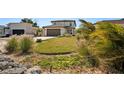 Two-story home boasting lush landscaping, a well-manicured lawn, and a two-car garage at 1876 Livingstone St, Sarasota, FL 34231