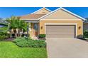 Charming single-story home boasts a well-manicured lawn and a two-car garage at 3835 Autumn Fern Ter, Sarasota, FL 34243