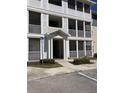Condo building entrance featuring a staircase, screened porches, and easy accessibility for residents and visitors at 4802 51St W St # 1420, Bradenton, FL 34210