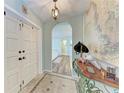 Inviting foyer featuring an arched doorway and decorative tile flooring at 508 67Th Avenue W Dr, Bradenton, FL 34207