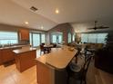 Open-concept kitchen features a large island with bar seating and seamlessly connects to the living area at 509 Stone Briar Dr, Ruskin, FL 33570