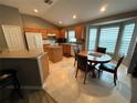 Bright kitchen with stainless steel appliances, island, and cozy breakfast nook with ample natural light at 509 Stone Briar Dr, Ruskin, FL 33570