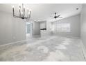 Large living room with subfloor ready for your choice of flooring and design at 5814 Garden Lakes Fern, Bradenton, FL 34203